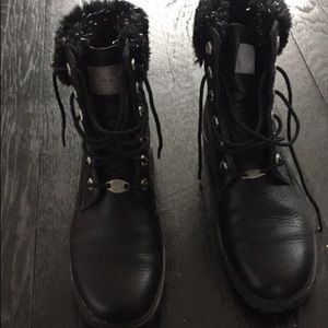 Black leather combat boots.